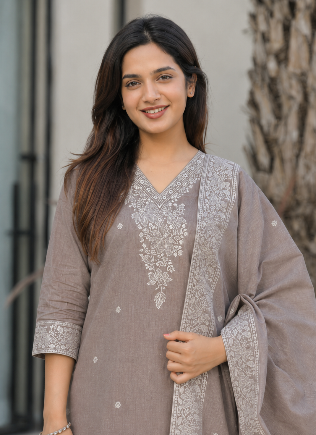 Chhaya grey cotton kurta set with white thread-flower work around the V neck and matching dupatta