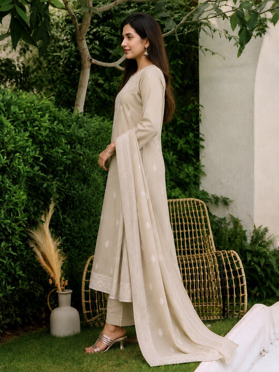 Side view of the Mogra beige cotton kurta set showing its straight fall and embroidered dupatta border