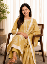 Pukhraj mustard cotton kurta set with larger white floral blooms on the dupatta