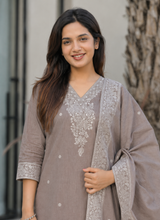 Chhaya grey cotton kurta set with white thread-flower work around the V neck and matching dupatta