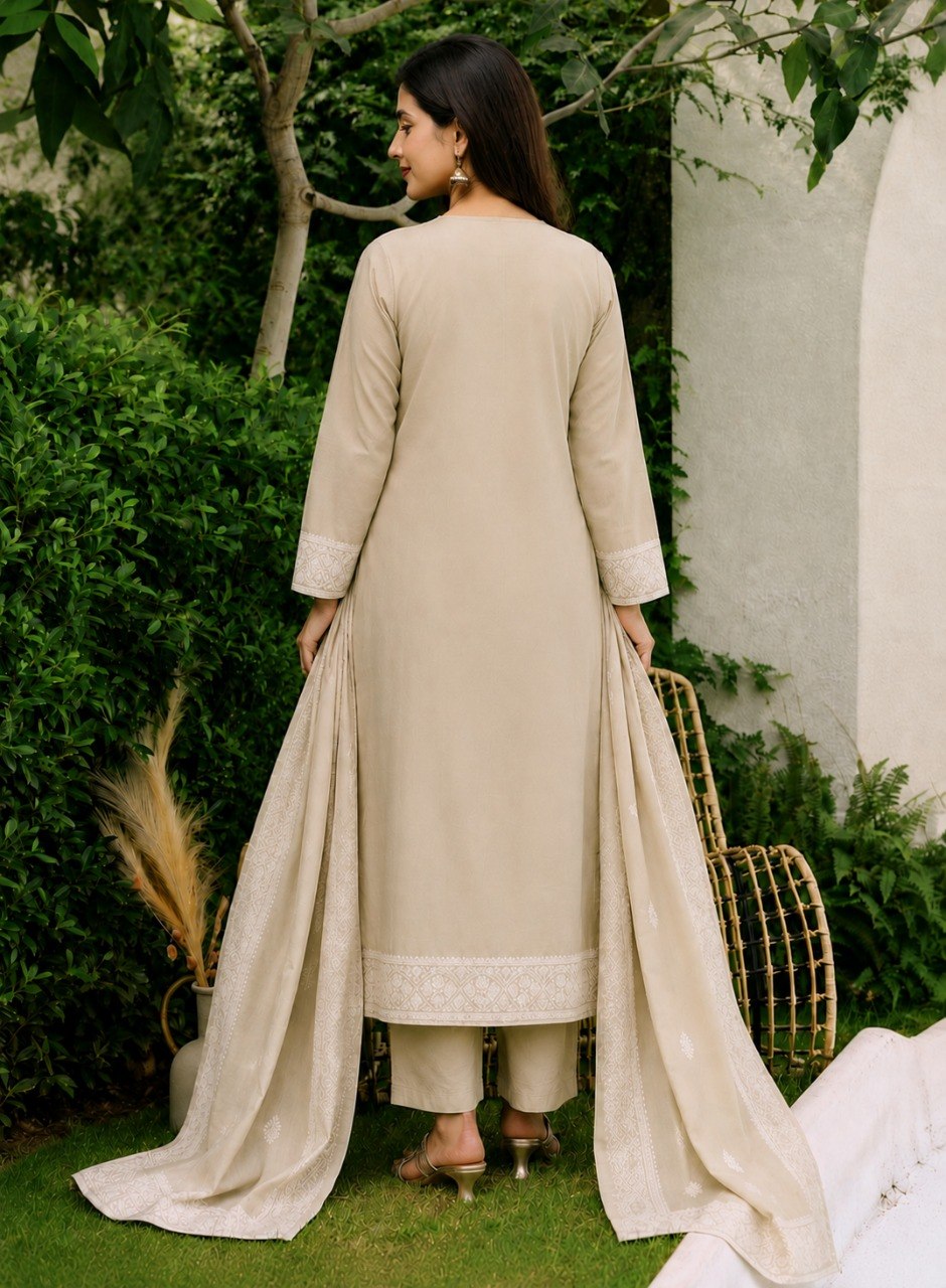 Back view of the Mogra beige cotton kurta set with embroidered borders on hem and dupatta
