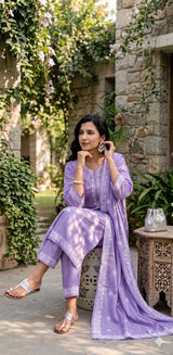 Kachnar lavender cotton kurta set with white embroidered yoke and floral dupatta border, seated view