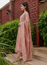 Side view of the Phoolwari peach cotton kurta set with the floral border dupatta over the shoulder
