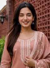 Close view of the white embroidered yoke panel on the Phoolwari peach cotton kurta